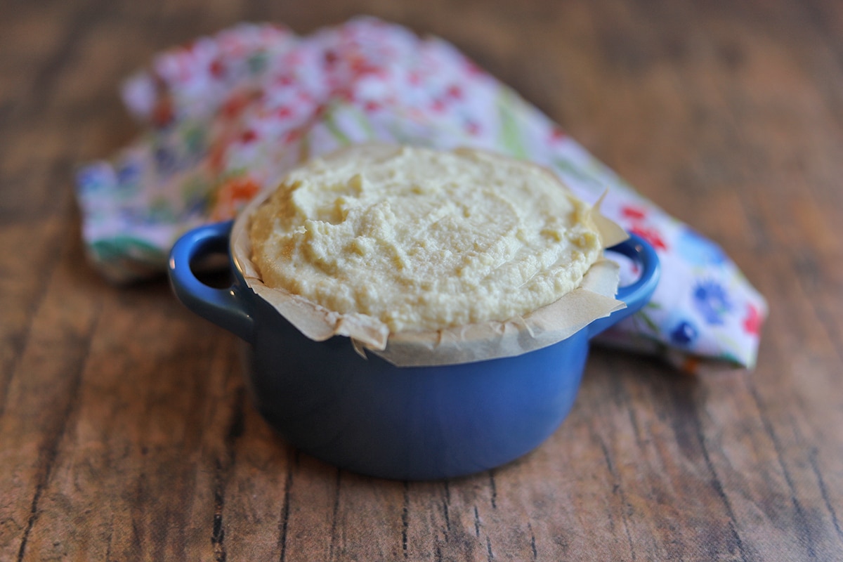 Softened almond cheese in Le Creuset cocotte.