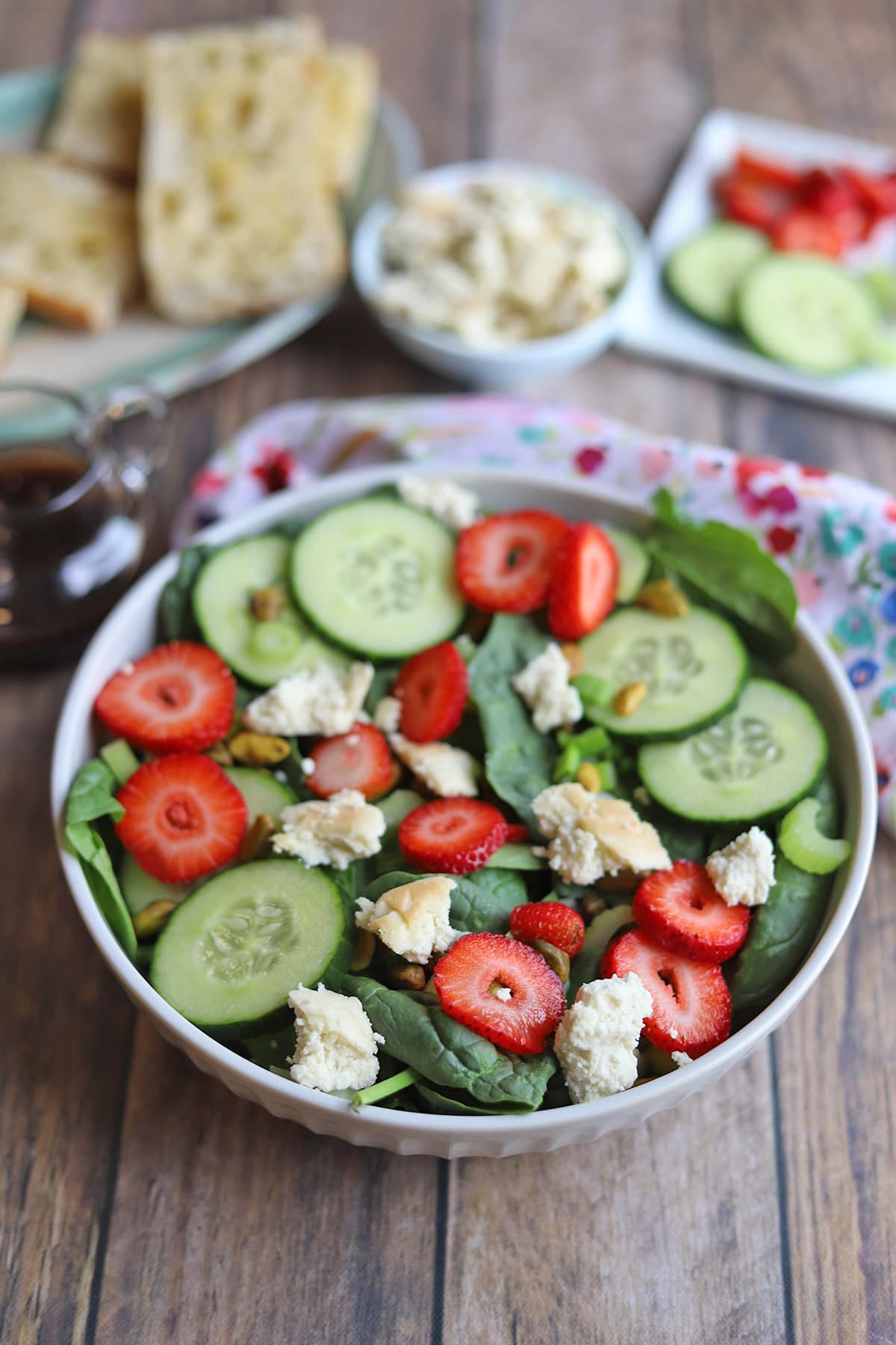 Spinach salad with strawberries and vegan feta.
