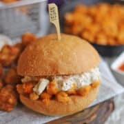 Vegan Buffalo chickpea sandwich with non-dairy blue cheese dressing.