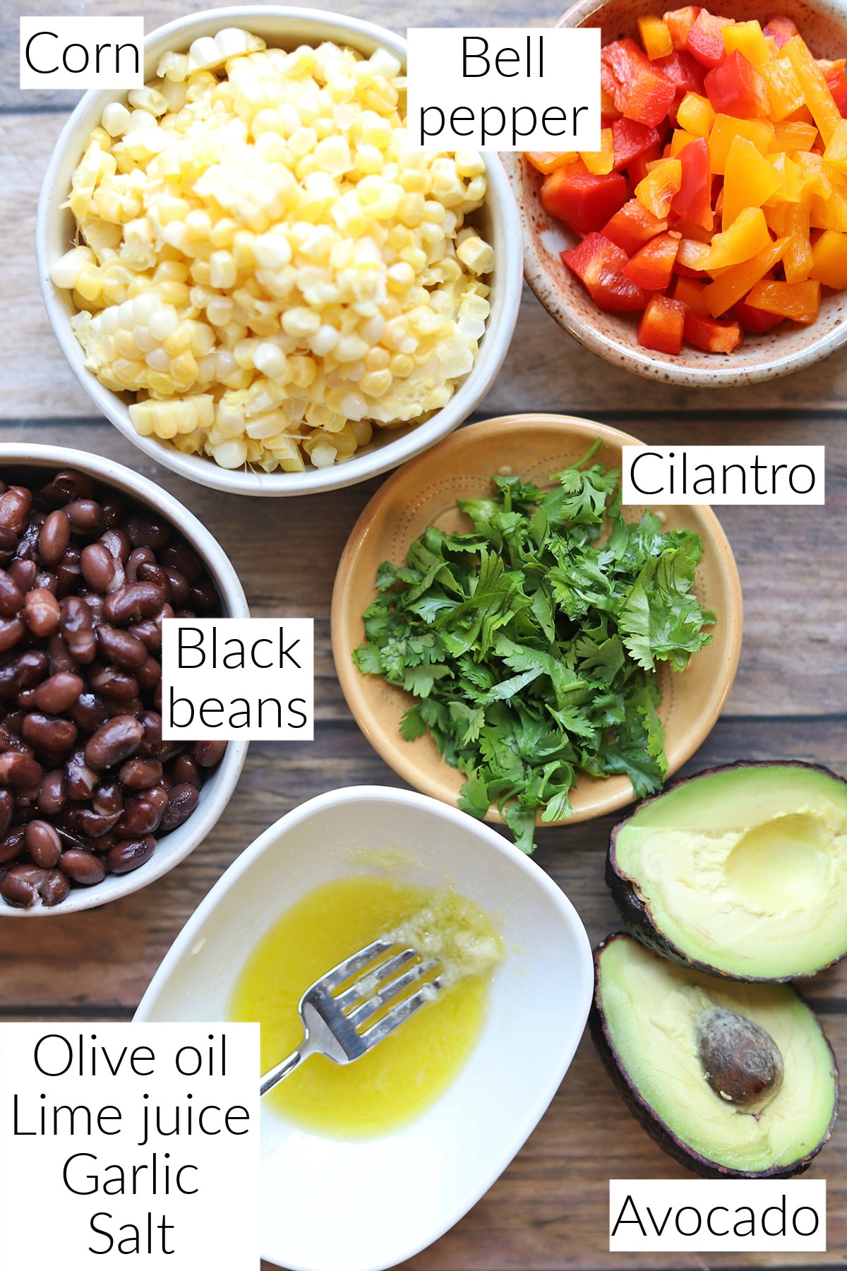 Labeled ingredients for corn black bean avocado salad.