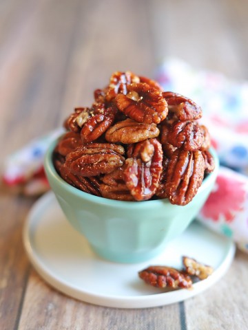Glazed nuts in blue bowl.