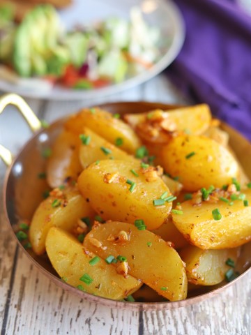 Close-up Yukon gold potatoes in serving dish.