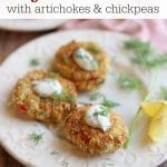 Text overlay: Vegan crab cakes with artichokes and chickpeas. Three cakes on a plate with dollops of lemon dill aioli.
