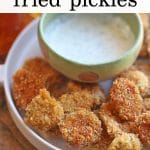 Text overlay: Beer battered fried pickles. Plate with fried pickles and ranch dip.