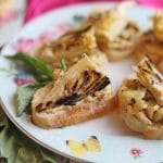 Crostini with hummus on platter.