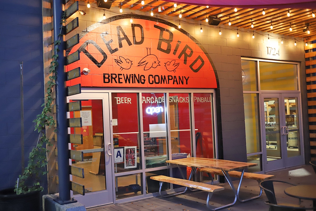 Exterior Dead Bird Brewing Company at night.