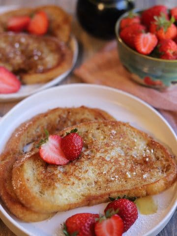 Plate with French toast and strawberries.