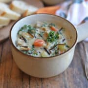 Creamy wild rice soup with seitan chicken, kale, and carrots in a cashew broth.