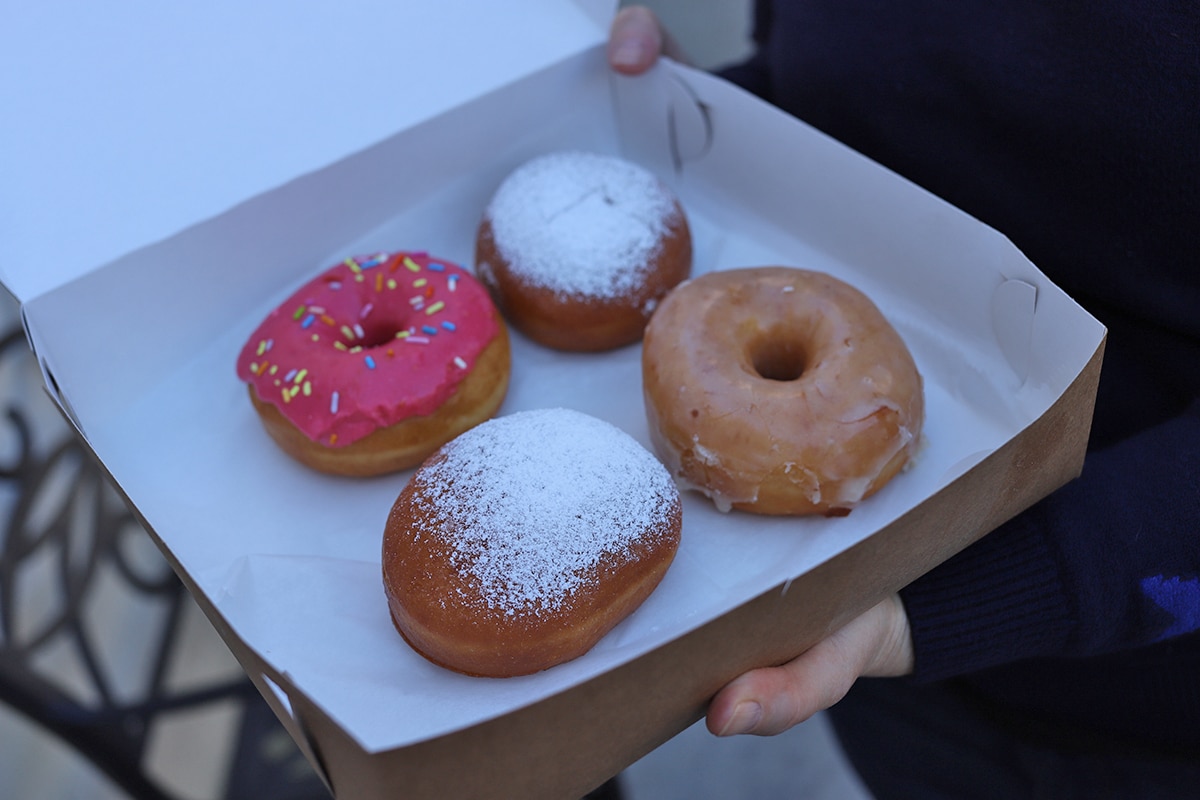Variety of donuts in box.