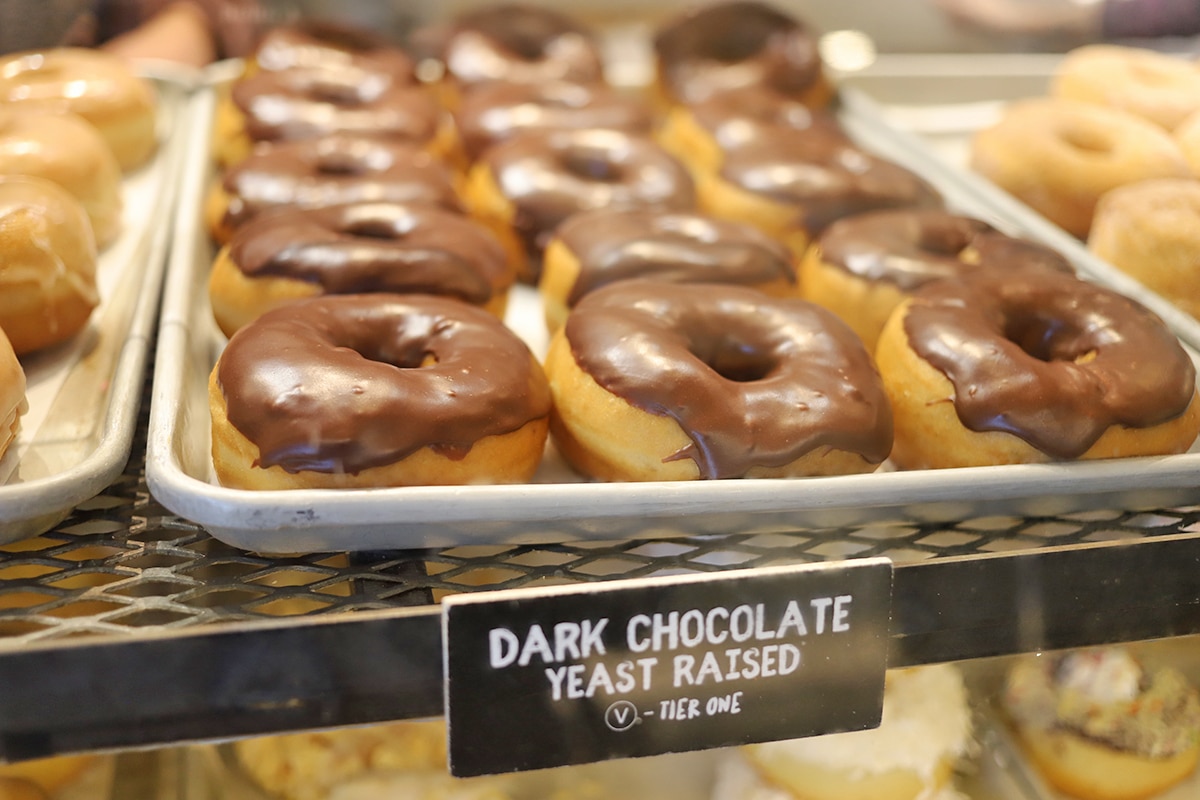 Chocolate covered donuts on display.