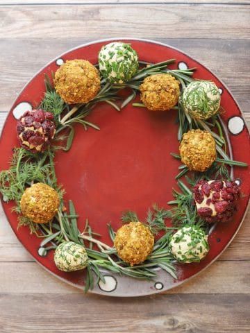 Vegan cheese balls holiday wreath on table.