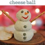 Text overlay: Vegan snowman cheeseball. Tofu cheese snowman on tray in front of Christmas tree.