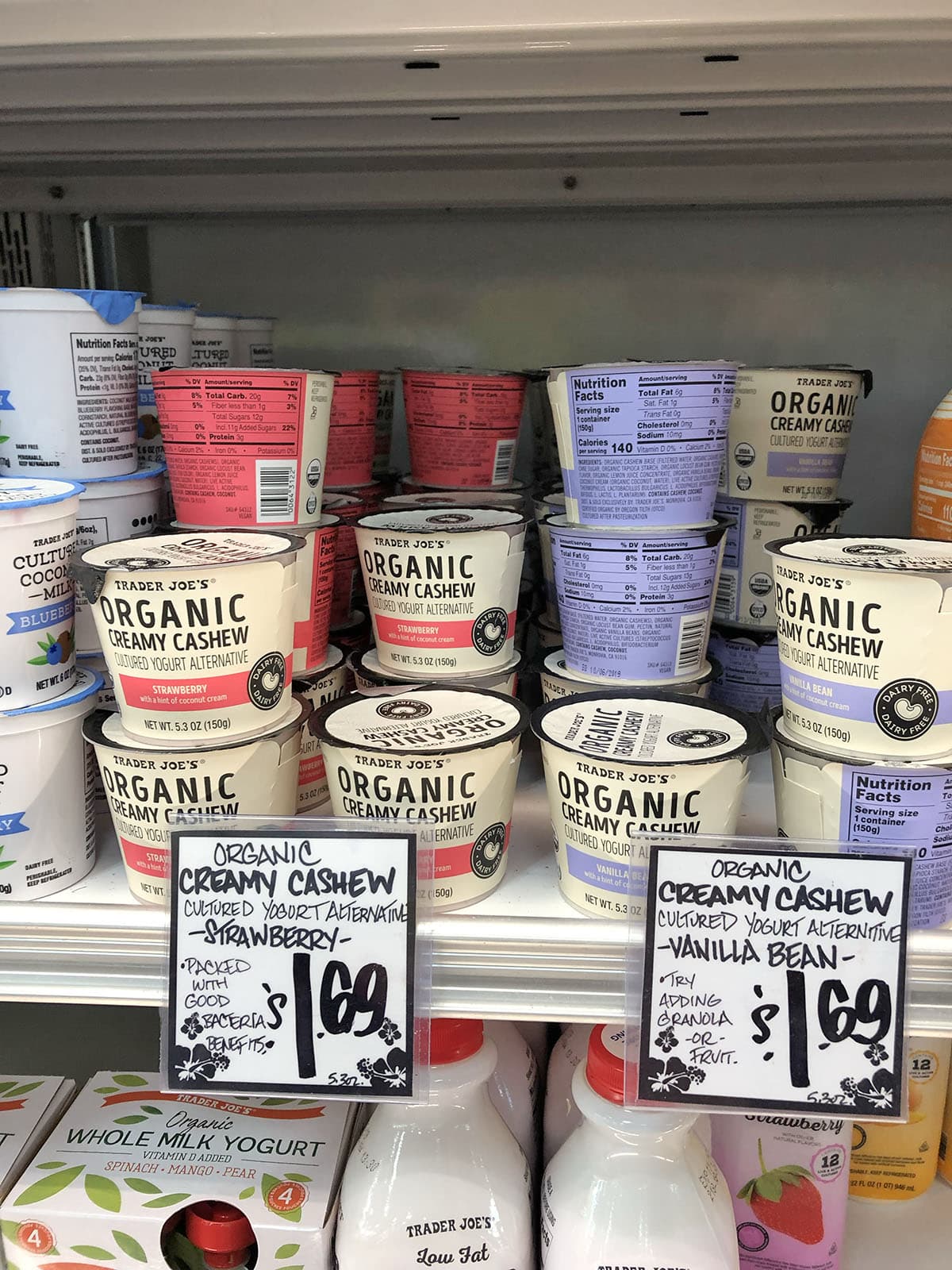 Organic cashew yogurt on the refrigerated shelf.