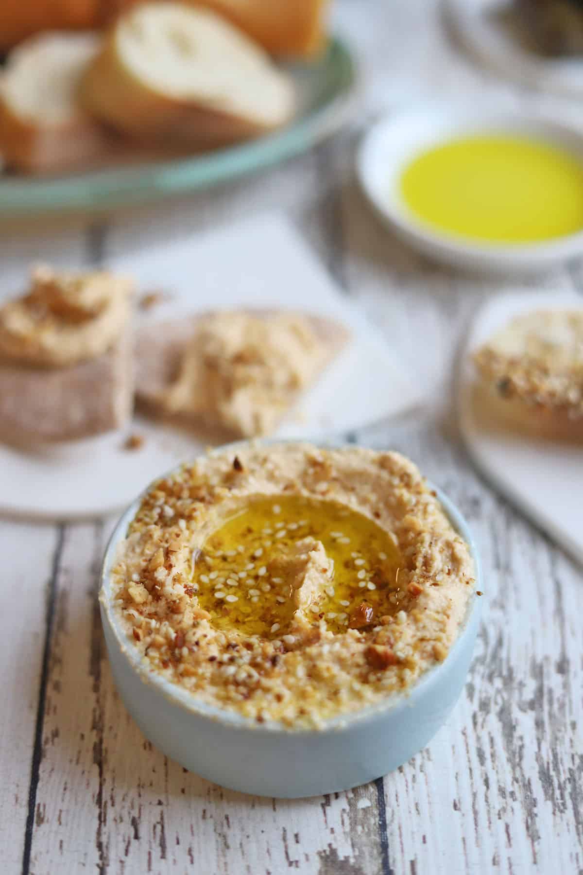 Dukkah sprinkled on bowl of hummus.