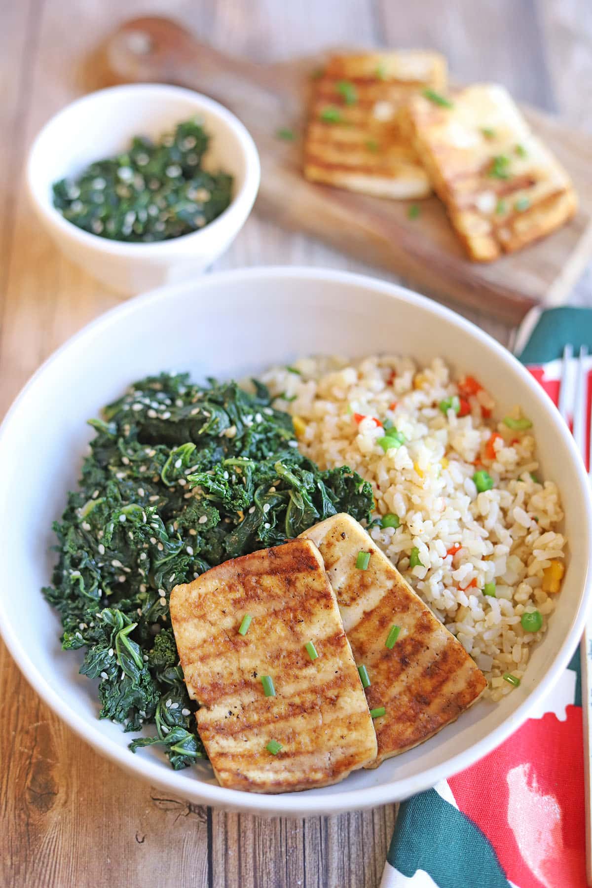 Sesame kale in bowl with tofu and rice.