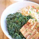 Text overlay: Steamed kale with sesame oil. Sesame kale in bowl with grilled tofu and rice.