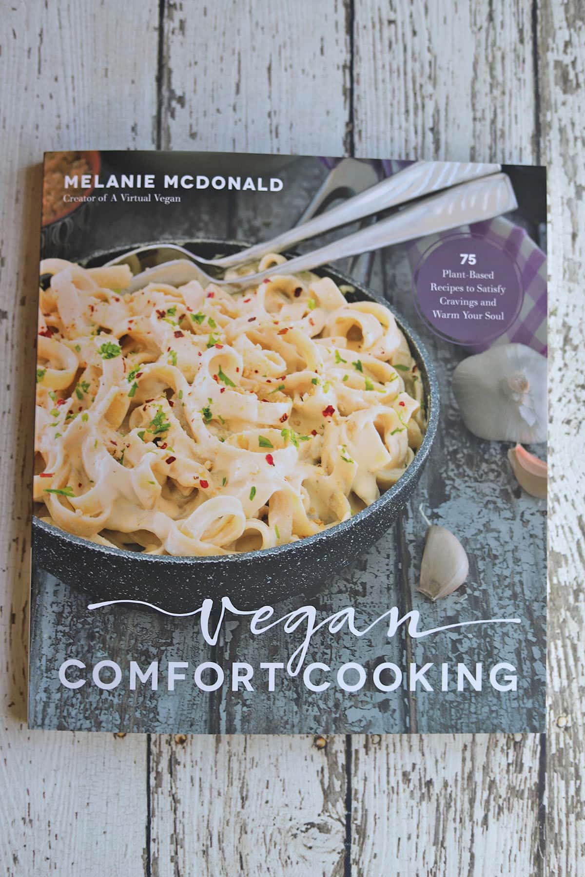 Vegan Comfort Cooking cookbook on table.