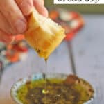 Text overlay: Olive oil bread dip. Oil dripping off of a piece of bread into bowl.