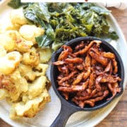 Text overlay: Vegan pulled pork with Soy Curls. Skillet with BBQ Soy Curls, greens, and vegan mac & cheese.