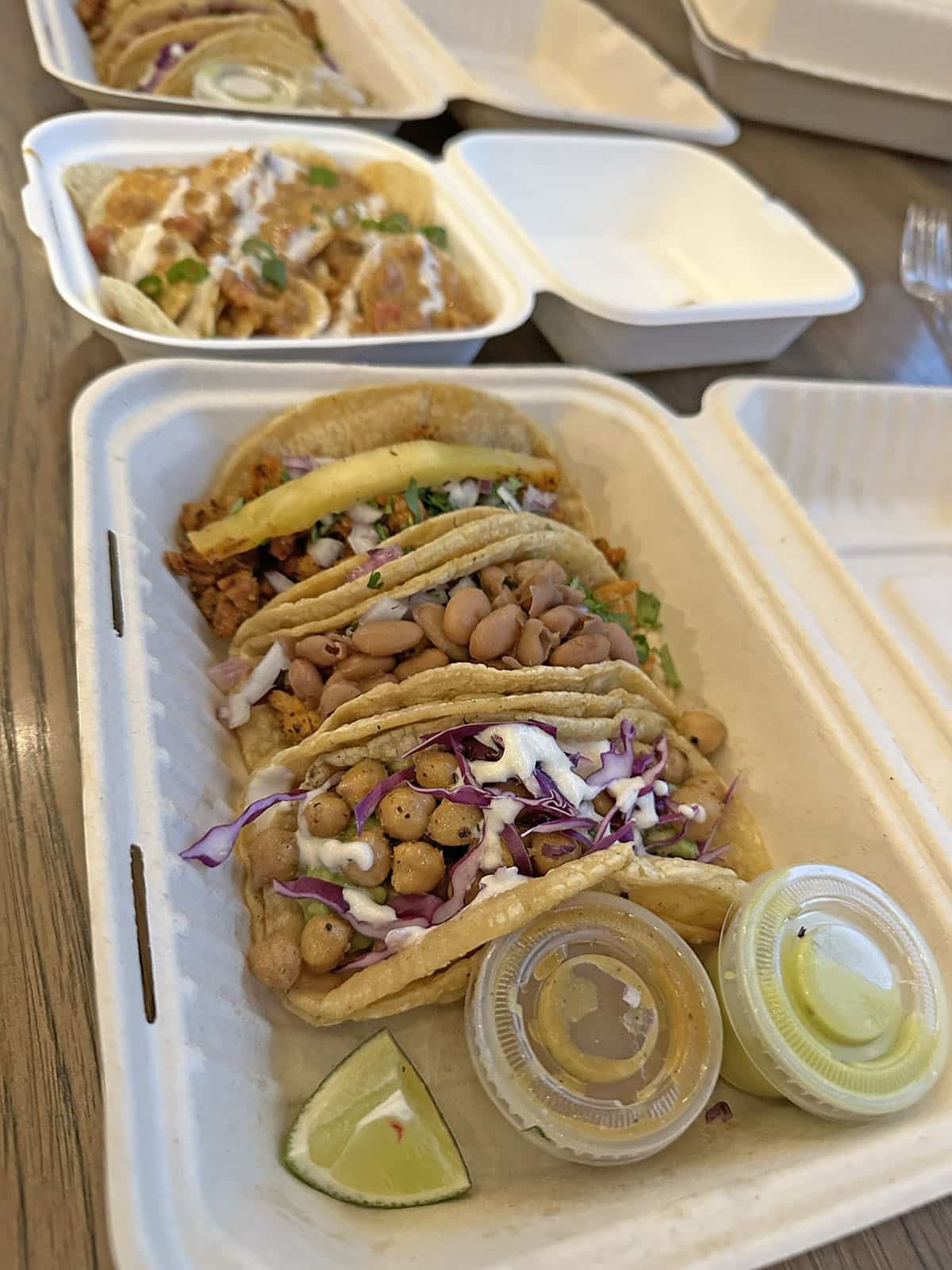 Chickpea tacos, pinto bean tacos, and soy tacos in cardboard container.