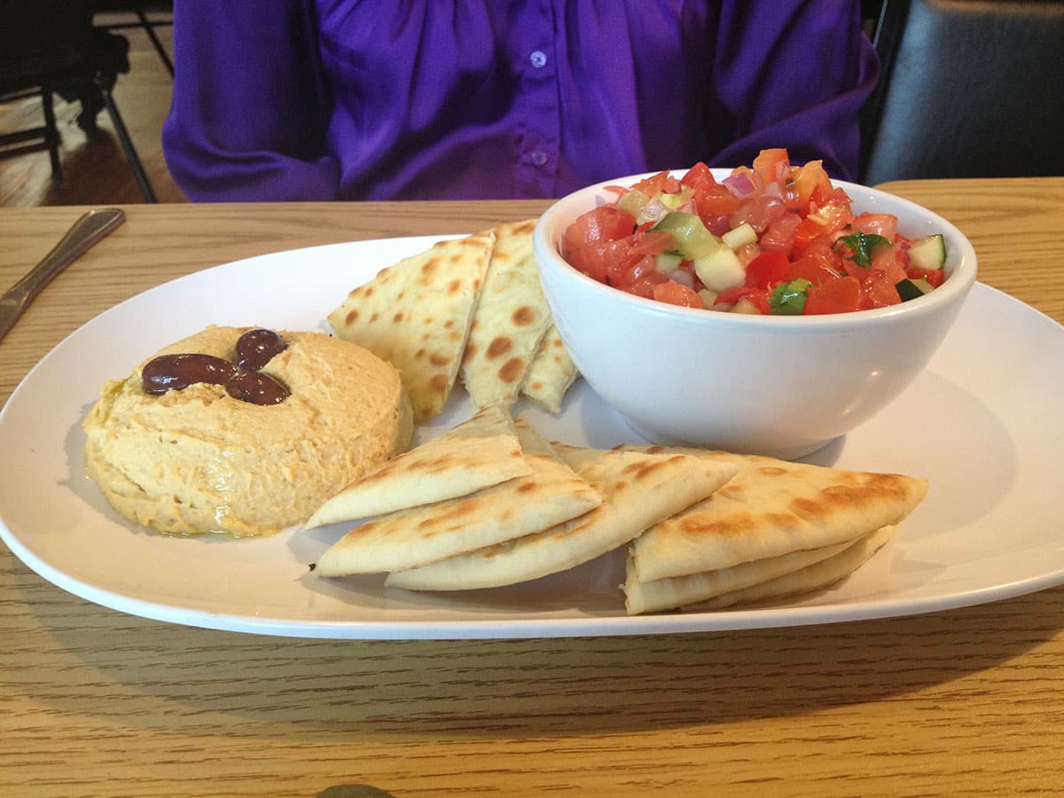 Hummus and pita with tomato salad.