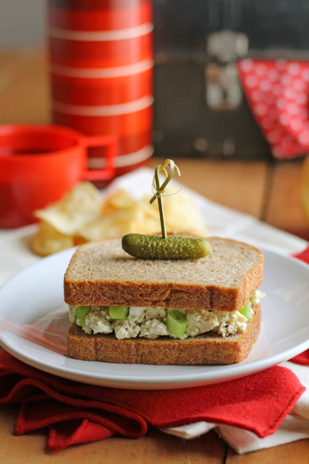 Vegan egg salad with potato chips in background.