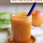 Text overlay: Carrot apple juice. Bright orange glass of juice with carrot, apple, romaine, celery, and cucumber juice inside.