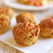 Mini vegan quiche bites on plate.
