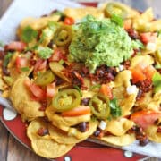 Loaded vegan nachos with cashew queso, soyrizo, black beans, and jalapenos.