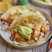 Gardein fishless filets on soft corn tortilla tacos with chipotle crema.