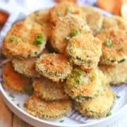 Air fried zucchini slices on platter.