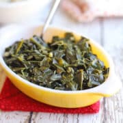 Garlicky collard greens in yellow mini casserole dish.