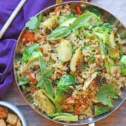 Vegan Brussels sprouts fried rice with basil in serving dish.