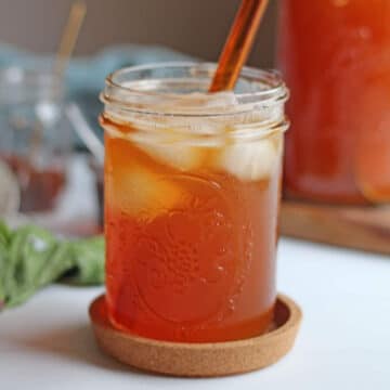 Glass of iced tea with peach juice.
