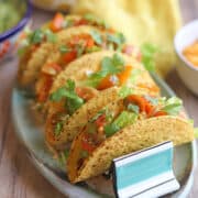 Platter of soy chorizo tacos with black beans.