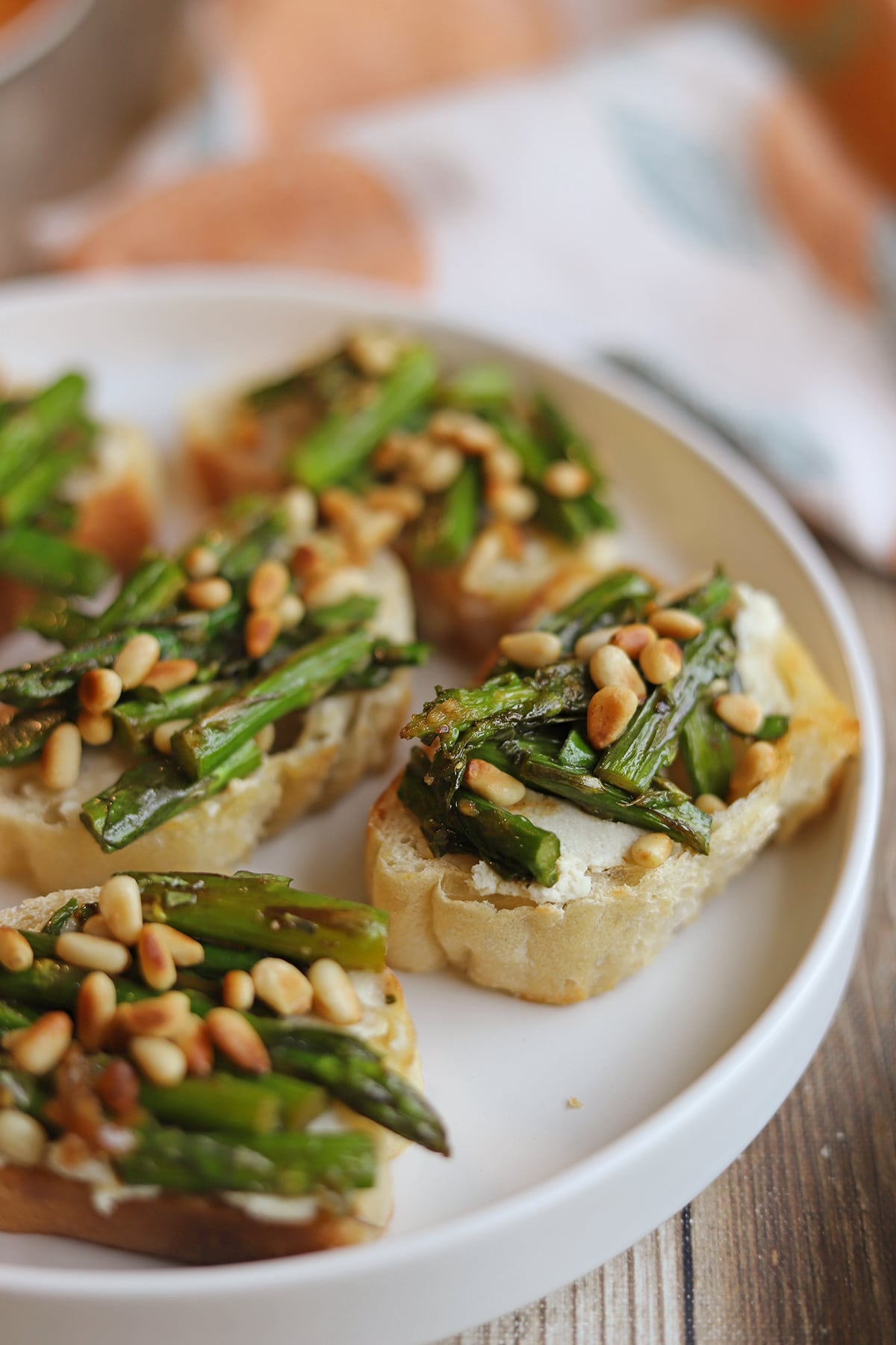 Roasted asparagus with pine nuts on toasted bread slathered with non-dairy cream cheese.