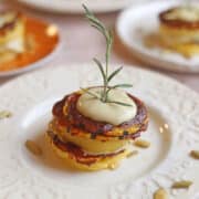 Fried polenta stacked with delicata squash glazed with barbecue sauce, and cashew cream.