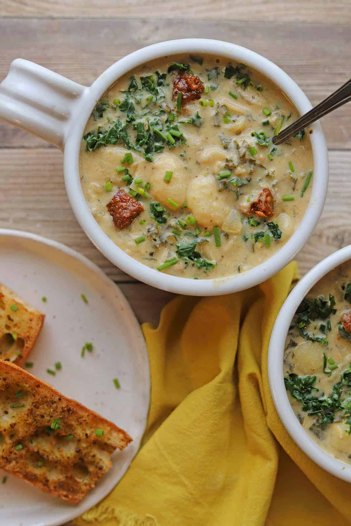 Creamy gnocchi soup with cashew broth, kale, and browned vegan sausage.