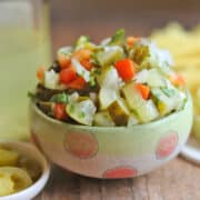 Pickle de gallo with bell pepper in green polkadot bowl.