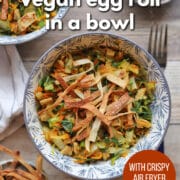 Text overlay: Vegan egg roll in a bowl with crispy air fryer wontons, get the recipe at cadryskitchen.com. Bowls with shredded cabbage, carrots, and vegan chicken.