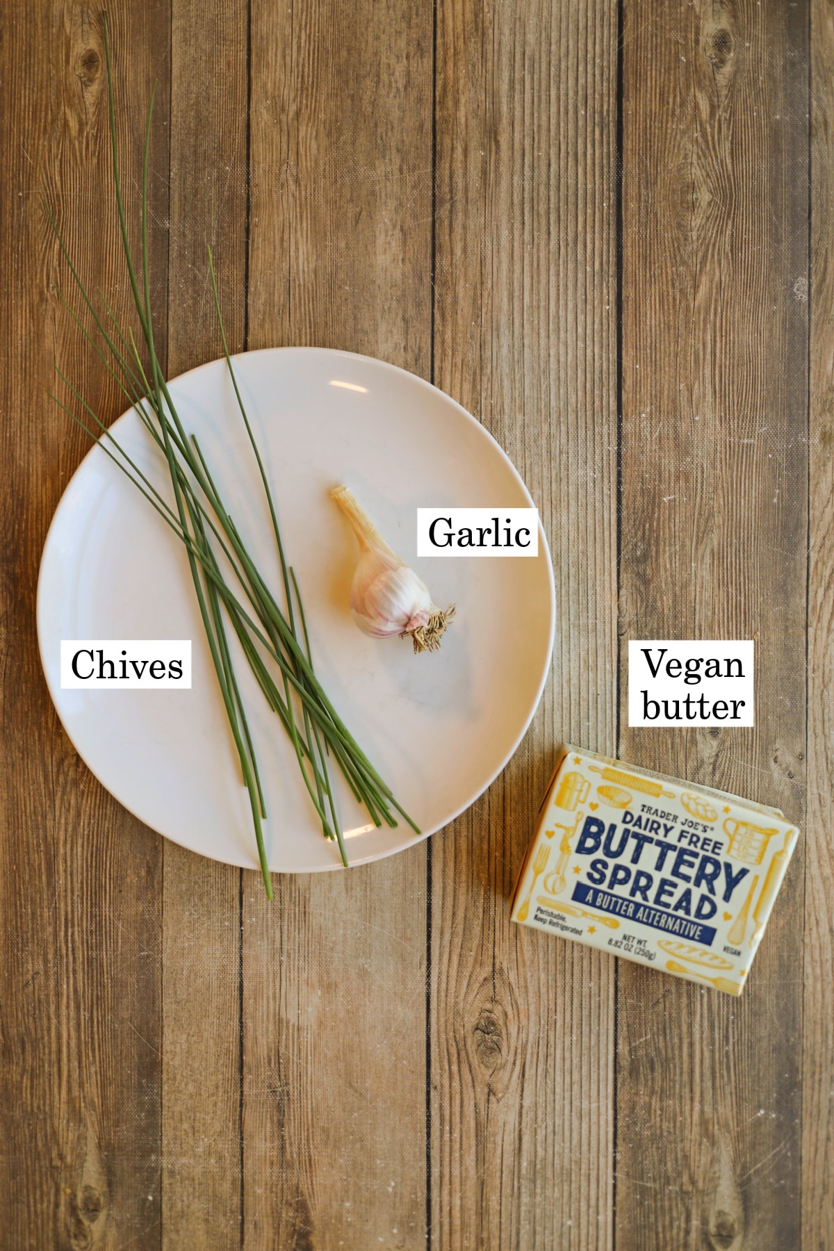 Labeled ingredients for vegan compound butter with chives, garlic, and buttery spread.