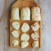Vegan butter board with three flavors of non-dairy butter - chive & garlic, lemon & dill, and sun-dried tomato & basil.