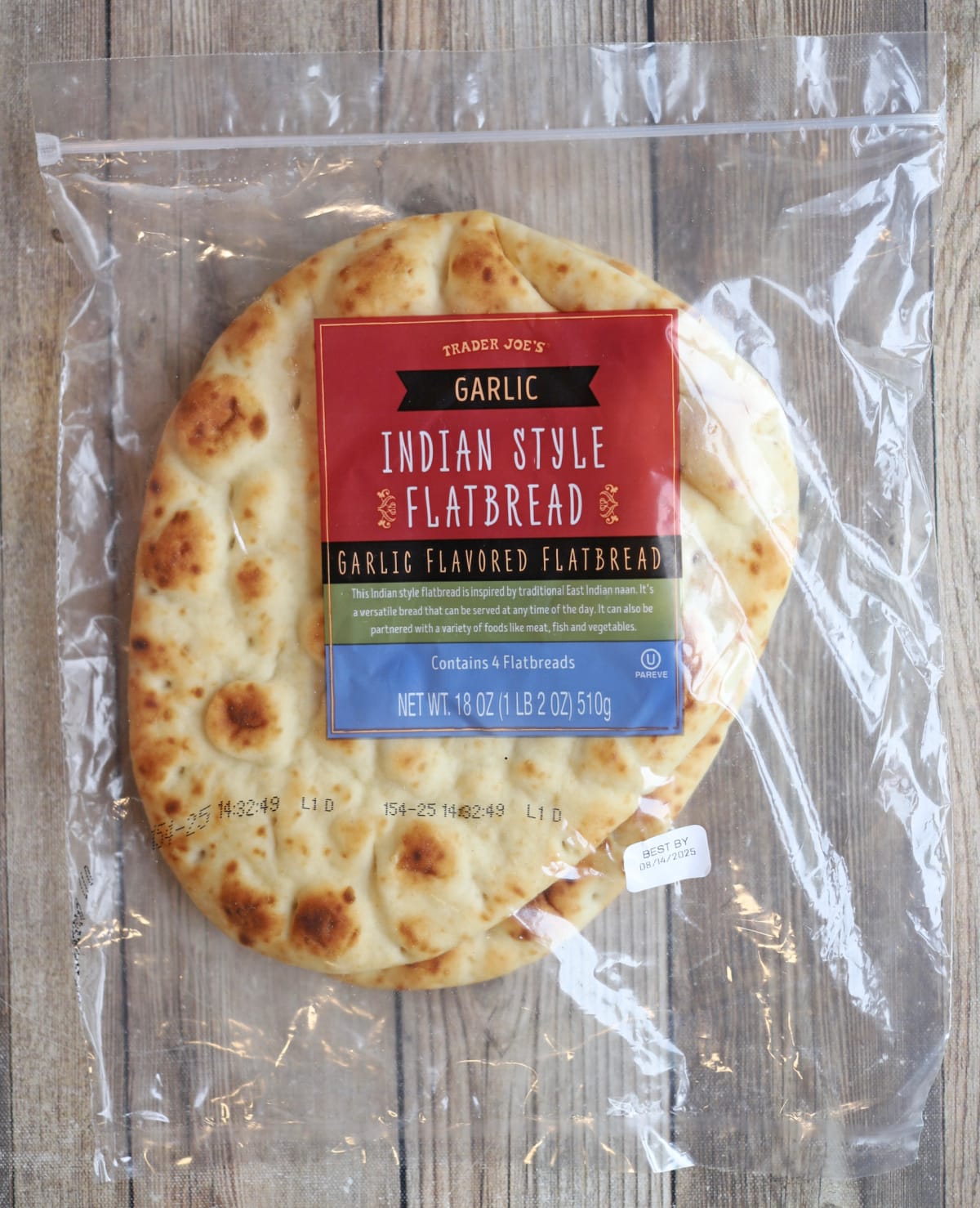 Trader Joe's garlic Indian style flatbread in packaging on table.