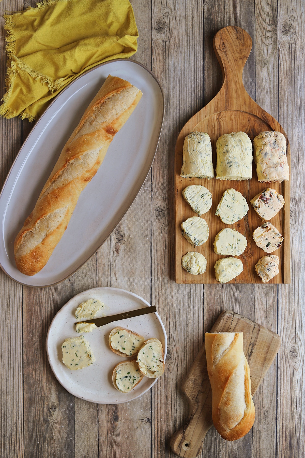 Vegan butter board with baguettes on table.