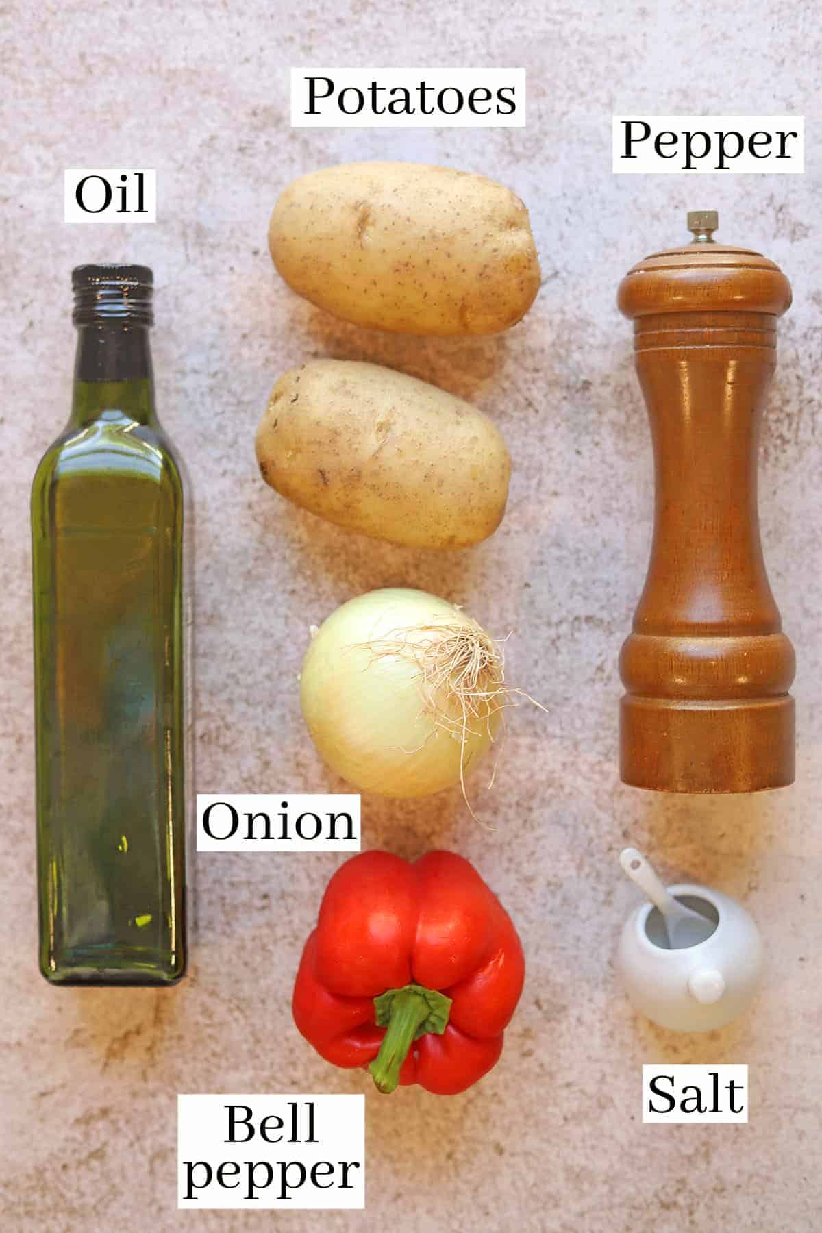 Labeled ingredients for oven roasted potatoes with peppers and onions.