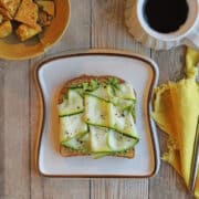 Zucchini ribbons on avocado toast vegan breakfast.