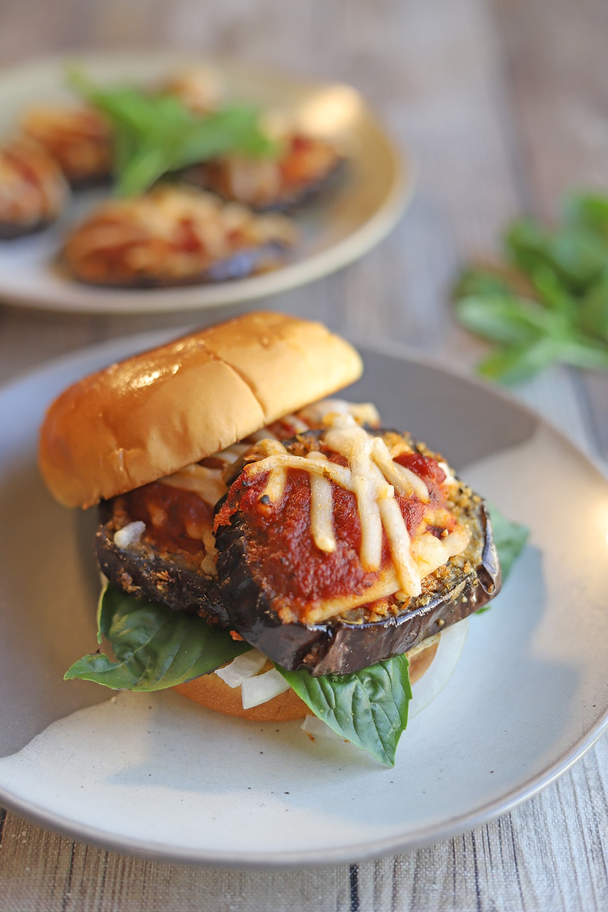 Vegan eggplant sandwich with non-dairy cheese and marinara.