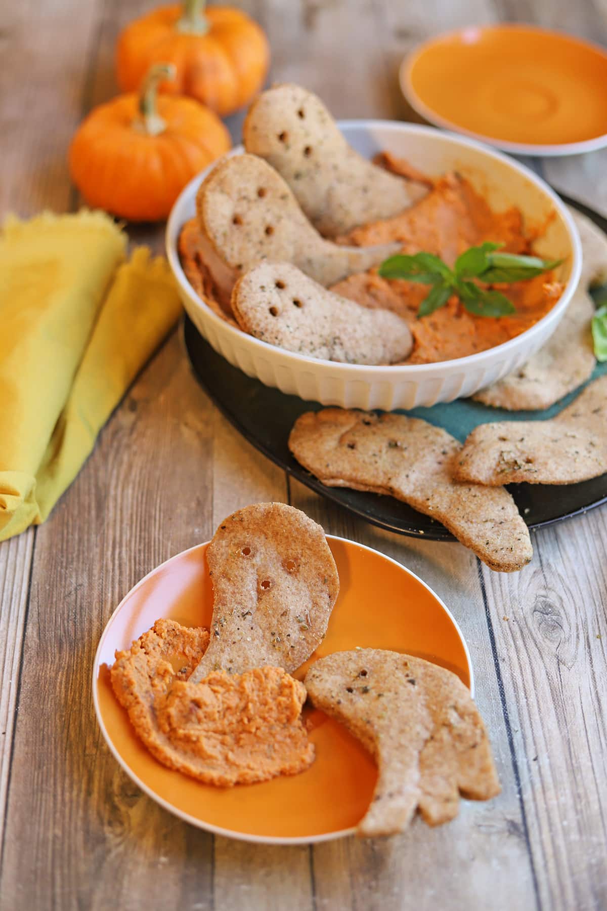 Vegan Halloween snacks with sun-dried tomato hummus and crunchy air fryer pita ghosts.