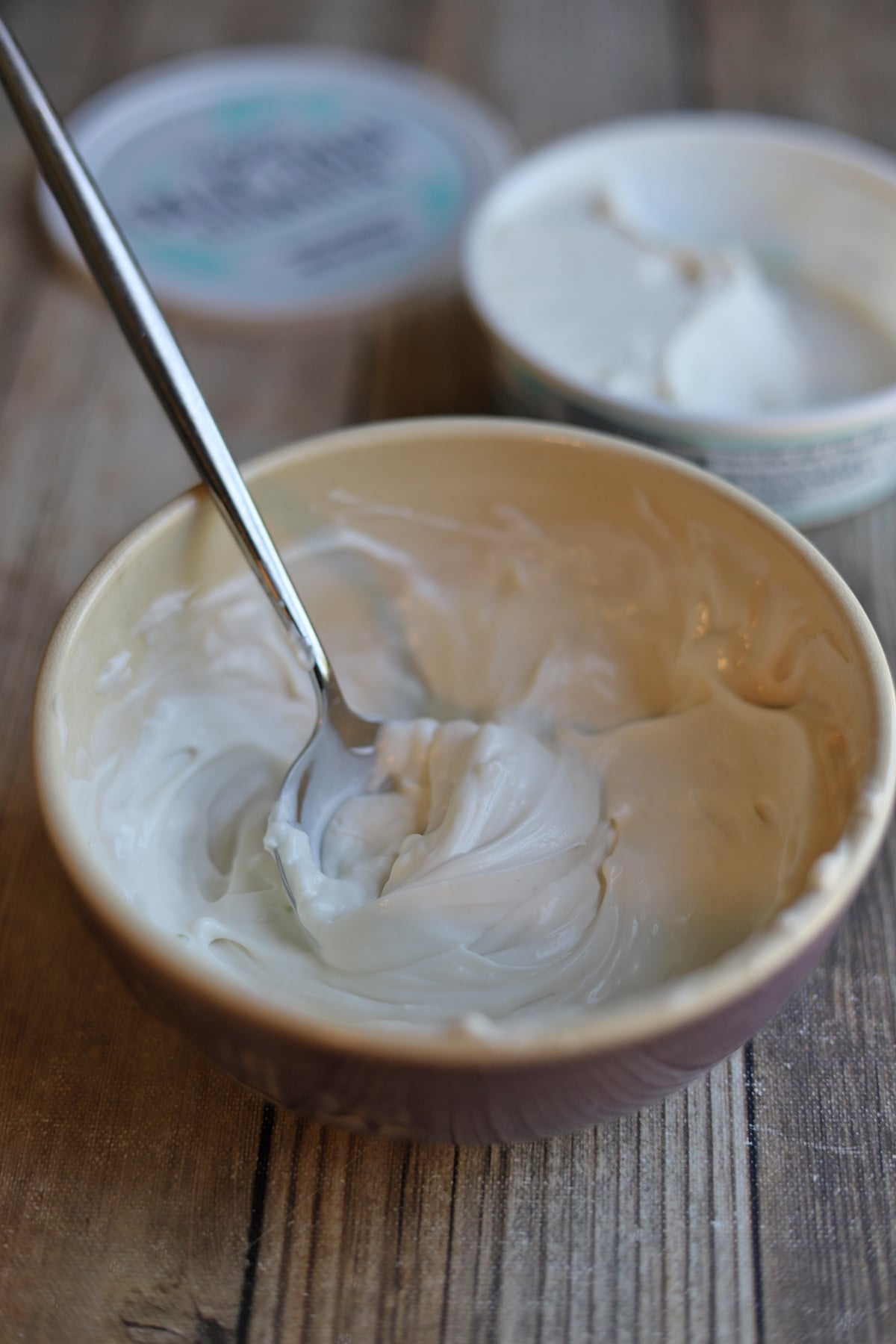 Bowl with Trader Joe's vegan cream cheese whipped with non-dairy milk until creamy and light.