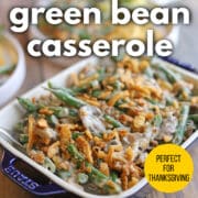 Text overlay: Vegan green bean casserole, perfect for Thanksgiving, get the recipe at cadryskitchen.com. Green bean casserole topped with fried onions.